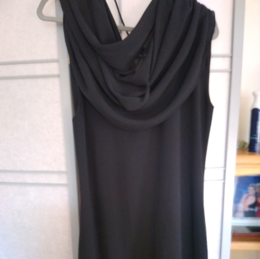 Draped neckline adds to the drama